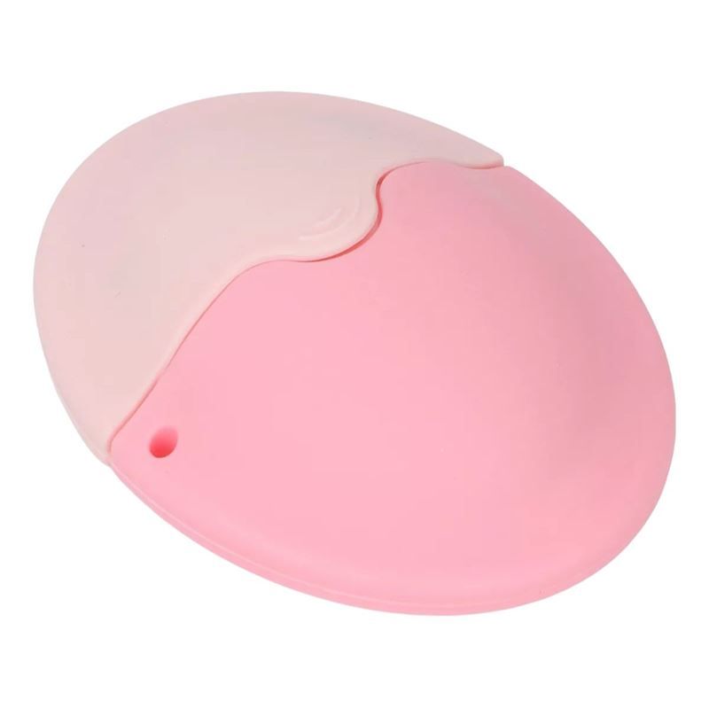 Produit ovale rose en deux parties. Partie supérieure rose clair, inférieure rose foncé. Petite ouverture.