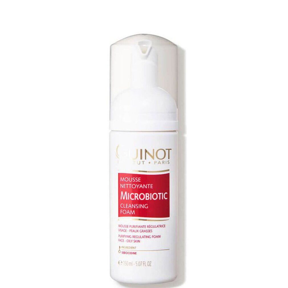 Flacon blanc Guinot Microbiotic Mousse. Étiquette rouge avec texte: Mousse Nettoyante, Microbiotic, Cleansing Foam. Peaux mixtes.