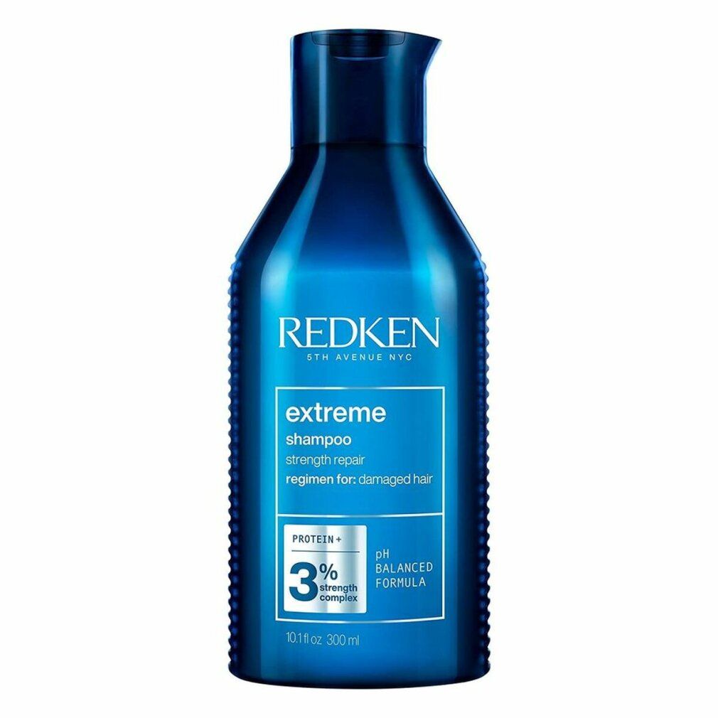Blauwe shampoo fles. Opschrift: REDKEN, extreme shampoo, 3% strength complex, pH balanced formula. 300ml.