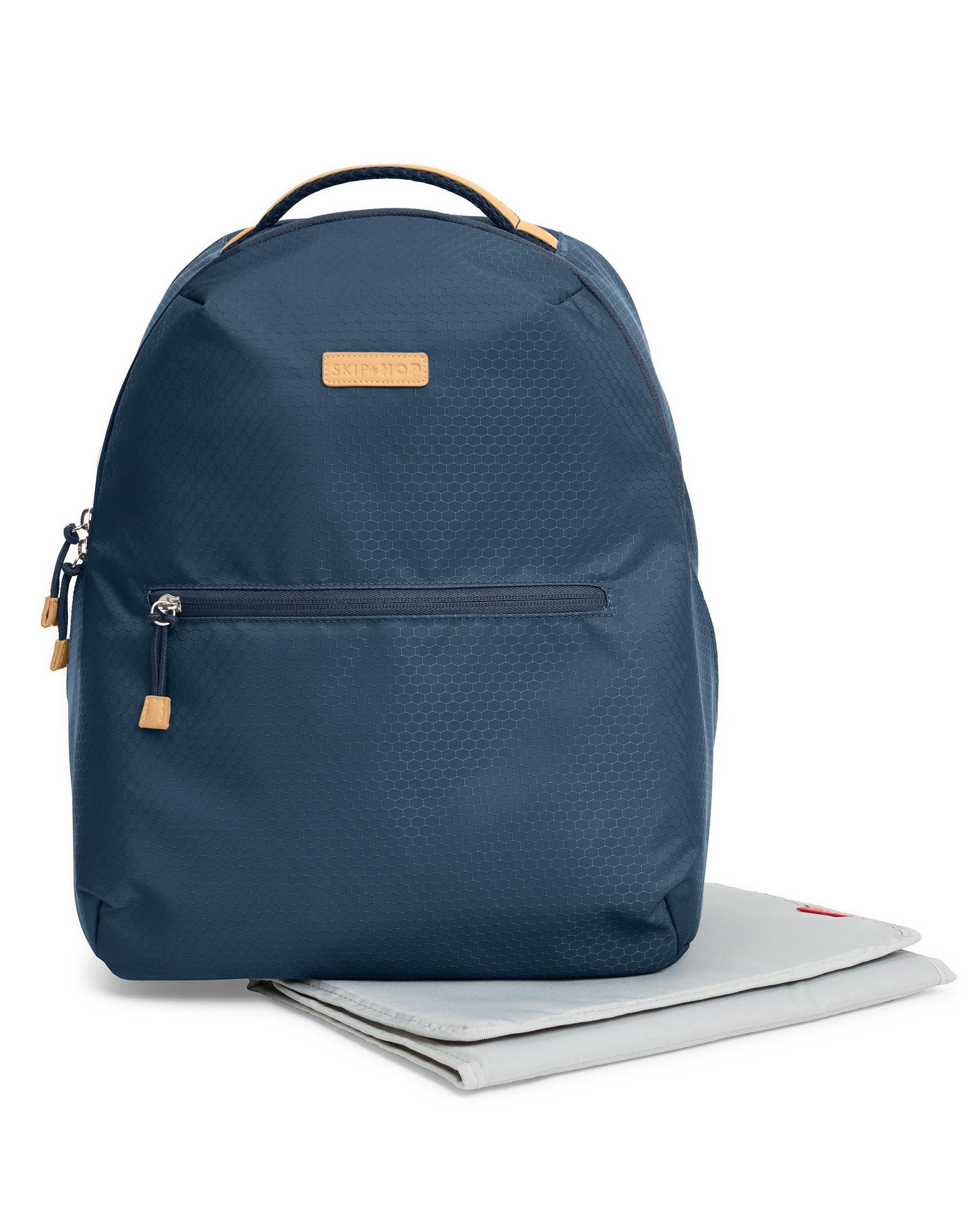 Donkerblauwe luiertas met aankleedkussen. Gele accenten.