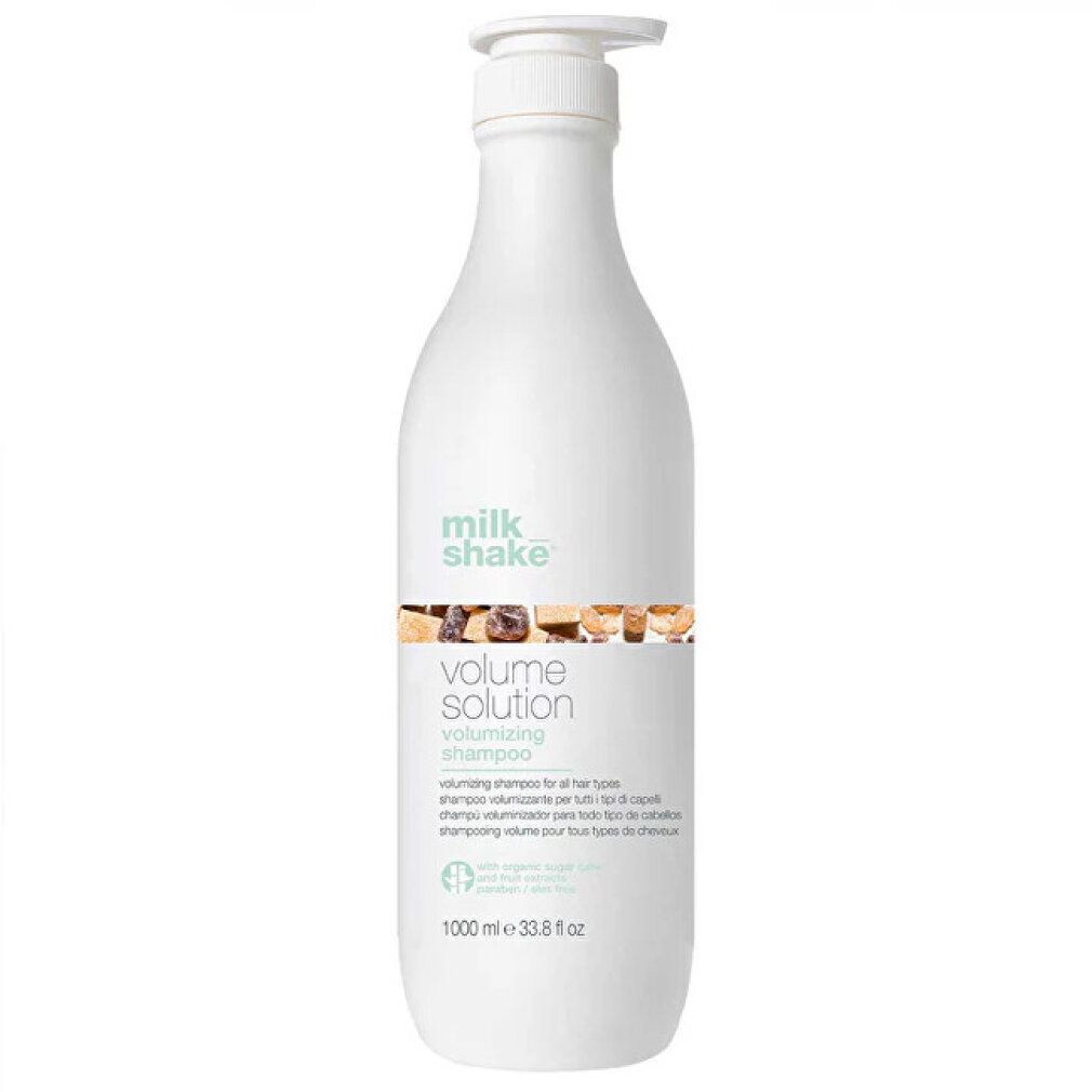 Witte shampoo fles met pomp. Opschrift: milk_shake, volume solution. 1000 ml.