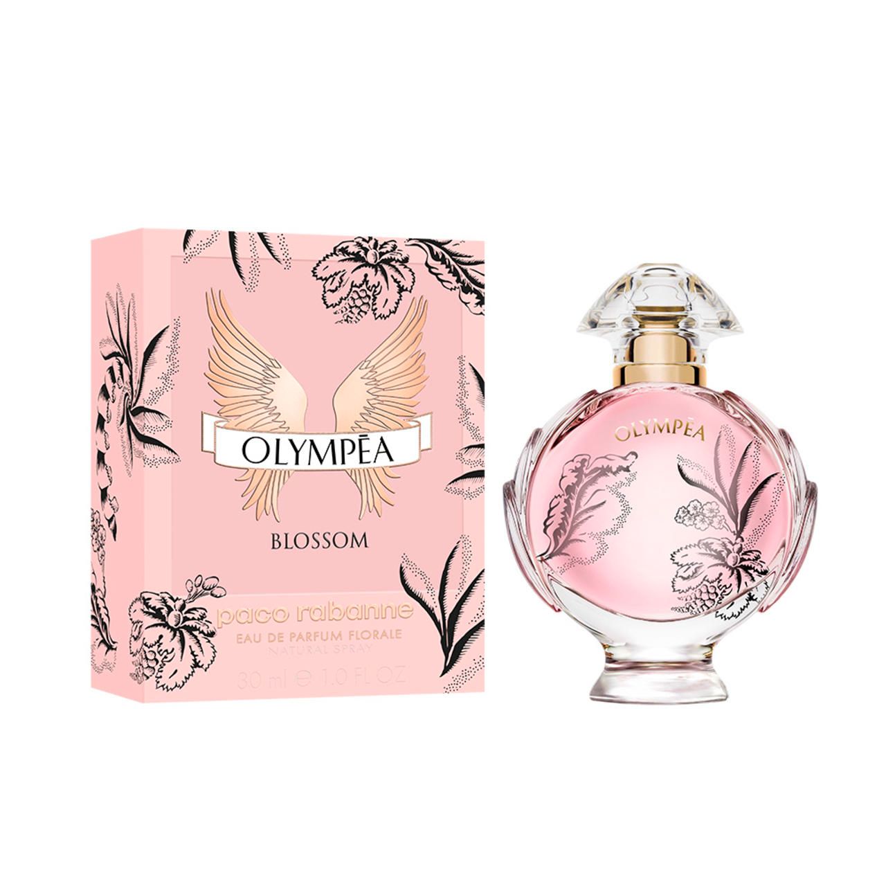 Flacon Olympéa Blossom et emballage. Flacon rose avec motifs floraux. Emballage rose avec motif d'ailes.
