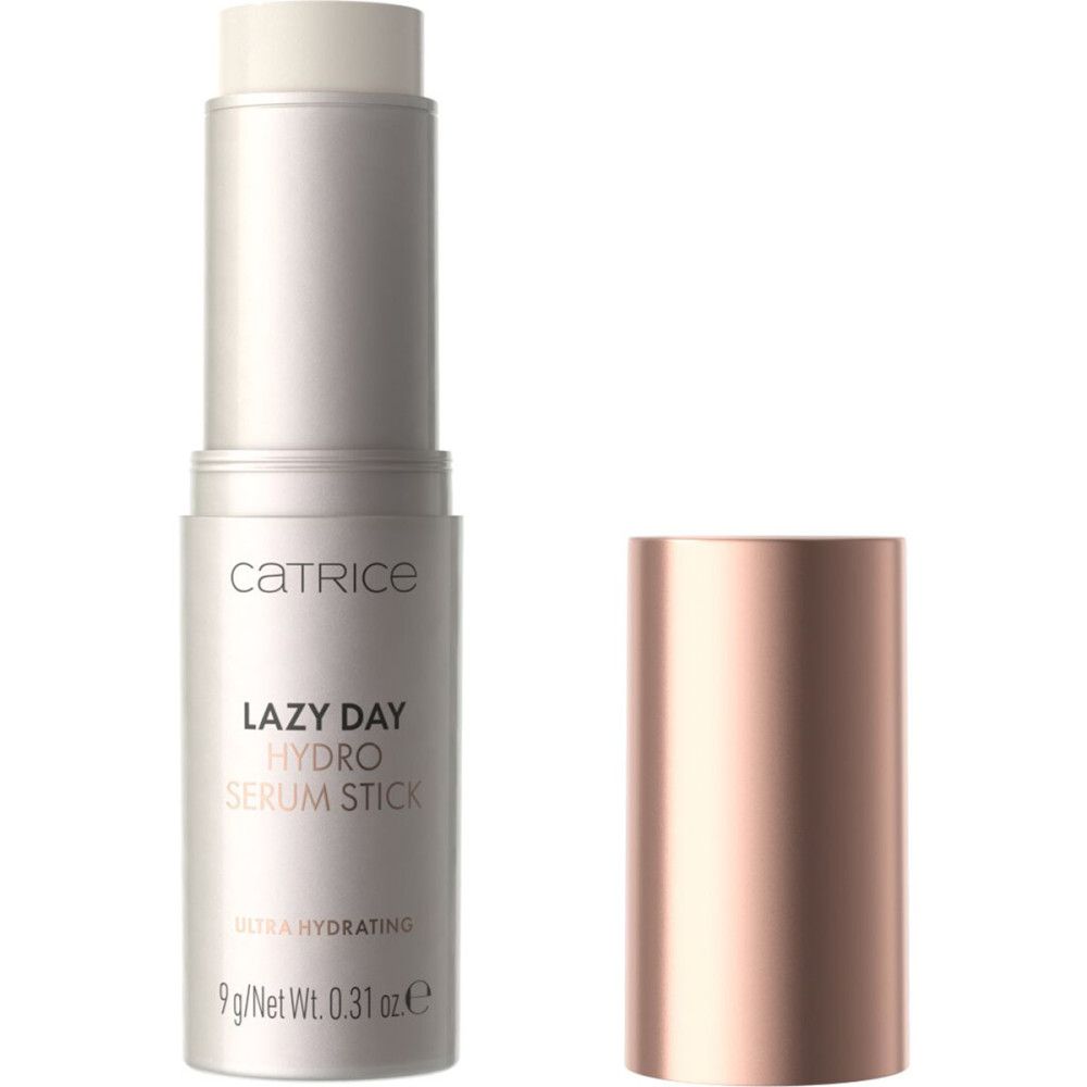 Stick de sérum avec bouchon or rose ouvert. Inscription: Catrice, Lazy Day Hydro Serum Stick. Ultra Hydrating. 9g/Net Wt. 0.31 oz e.