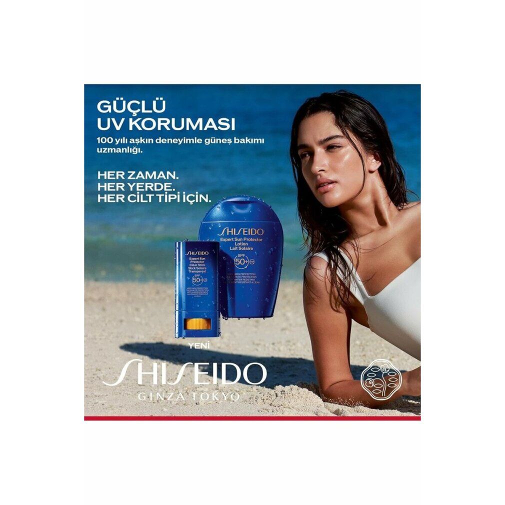 Publicité avec femme à la plage. Produits: Shiseido Sun Expert Stick Solare SPF50 et flacon. Texte: Güçlü UV Korumasi.