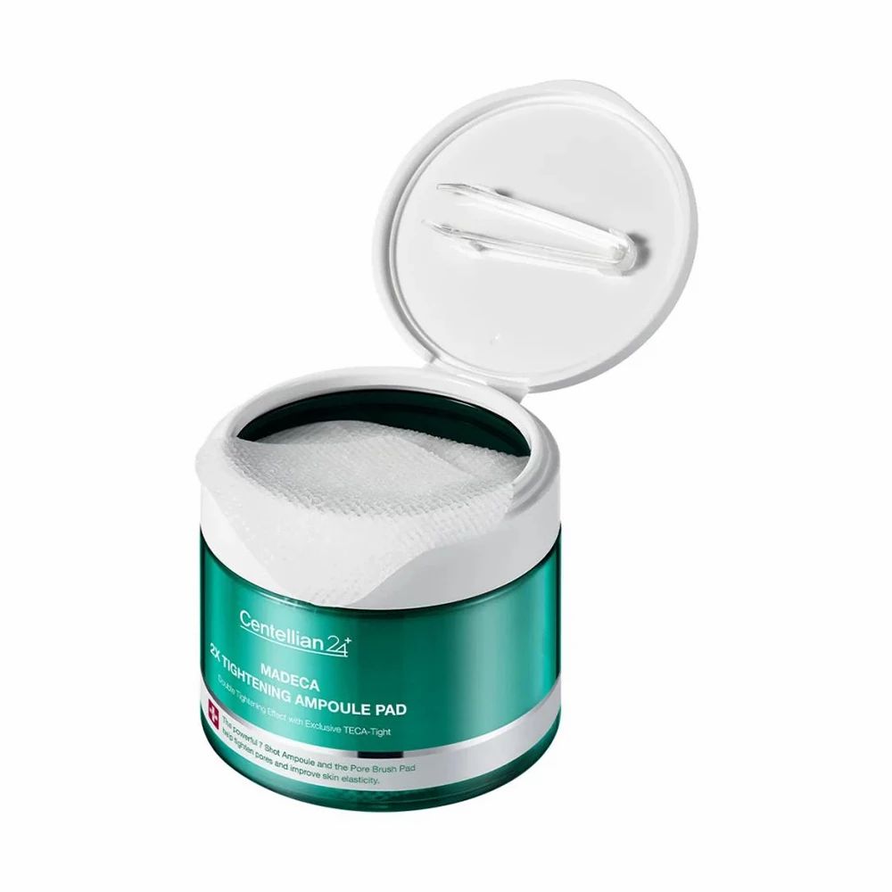 Boîte verte avec couvercle blanc, ouverte. Tampons visibles. Inscription: Centellian 24, Madeca 2X Tightening Ampoule Pad.