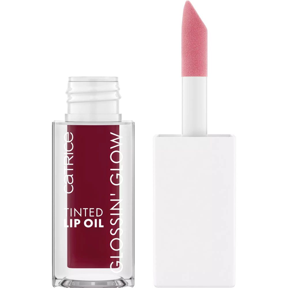 Getinte lipolie in glazen fles met applicator. Opschrift: Catrice, TINTED LIP OIL, GLOSSIN' GLOW. Applicator roze.
