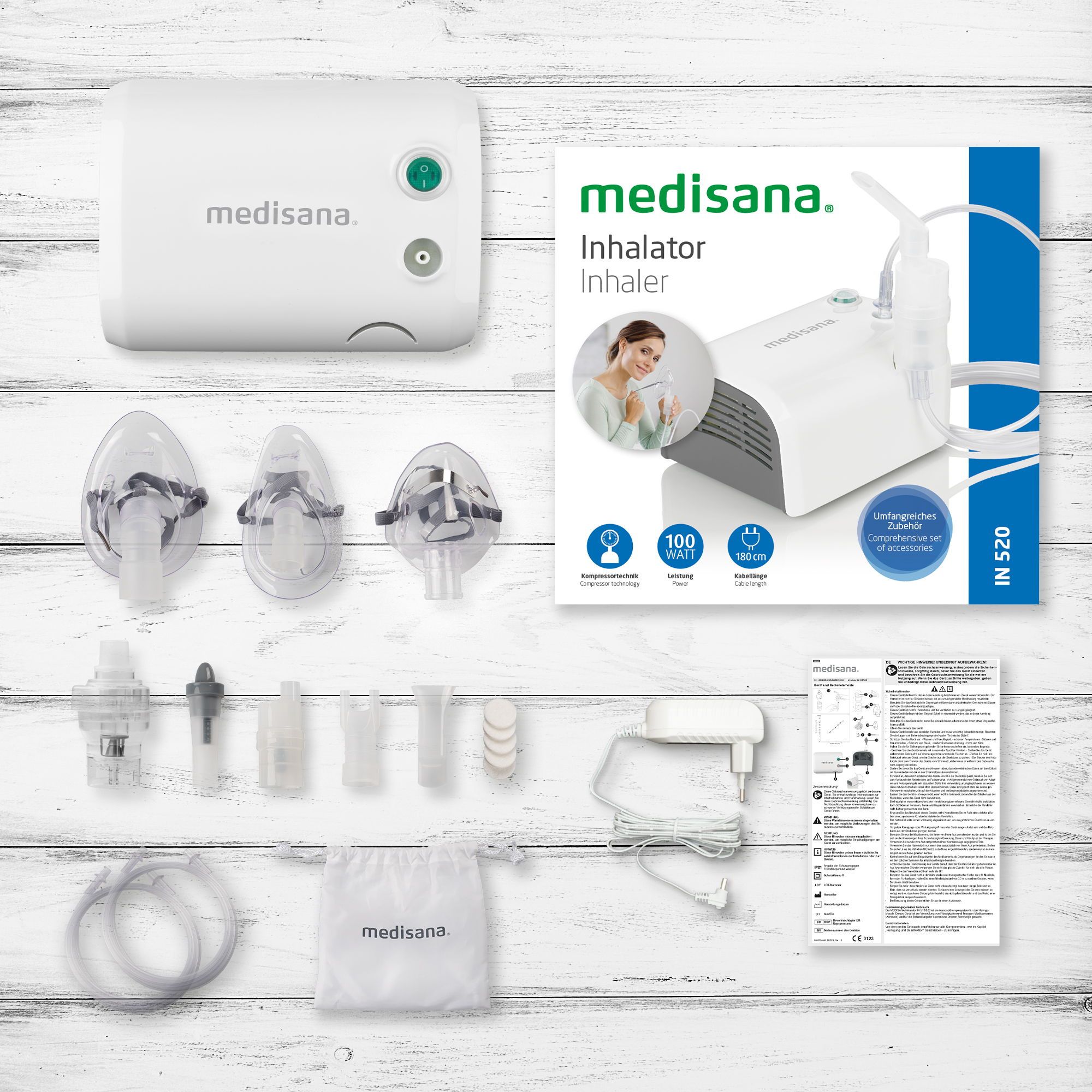 Inhalateur Medisana IN 520 avec accessoires : nébuliseur, masques, tuyaux, adaptateur secteur et pochette.