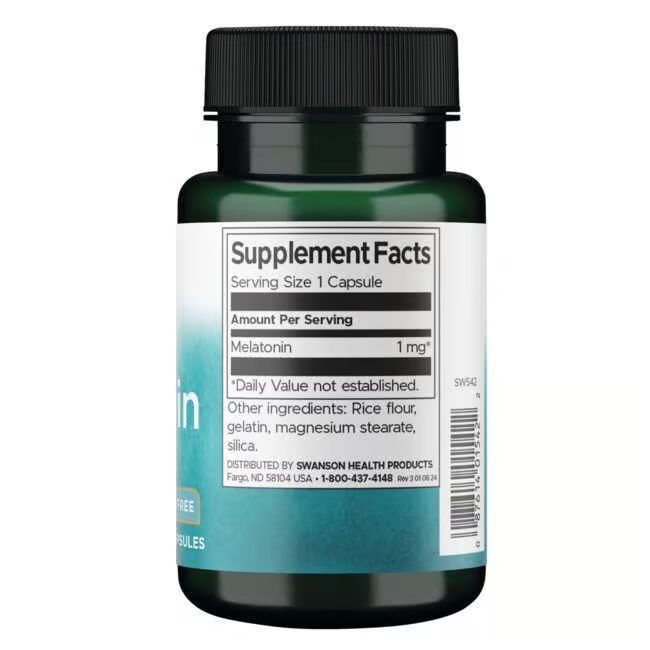 Dos de la bouteille. Inscription: Supplement Facts, Mélatonine 1mg, Ingrédients: farine de riz, gélatine, stéarate de magnésium, silice.