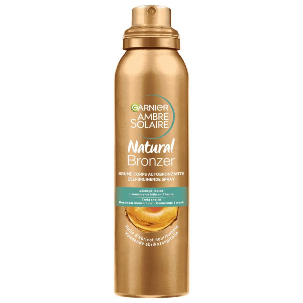 Flacon spray doré. Inscription: Garnier Ambre Solaire Natural Bronzer. Spray autobronzant pour le corps.