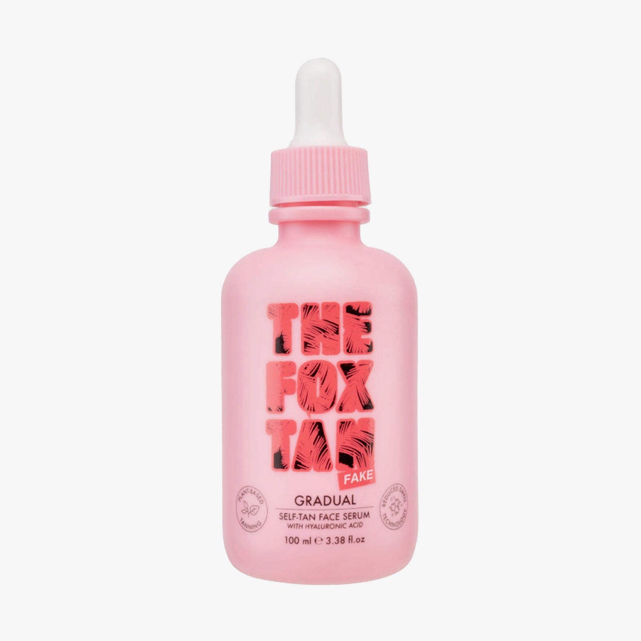 Flacon rose avec compte-gouttes blanc. Inscription : THE FOX TAN. GRADUAL SELF-TAN FACE SERUM.
