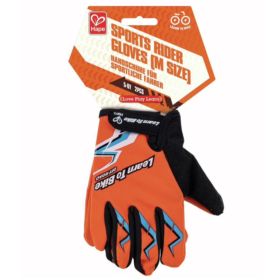 Hape Sports Rider Gloves (M Size) in retailverpakking. De oranje handschoenen met zwarte accenten zijn ontworpen om te fietsen. Op de verpakking staat "Handschoenen voor sportieve rijders". Het logo "Learn to Bike Off Road" is ook zichtbaar.