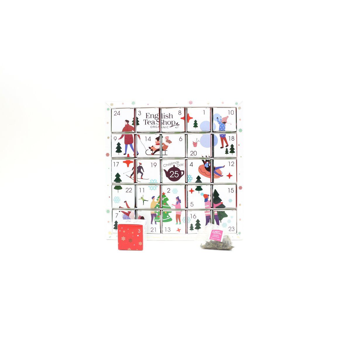 Adventskalender, wit, met wintermotieven. English Tea Shop logo. 25 vakjes. Geopende vakjes en theezakjes.
