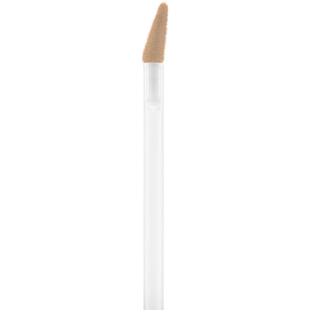 Applicateur du correcteur sérum Catrice. Manche blanc, éponge beige. Gros plan.