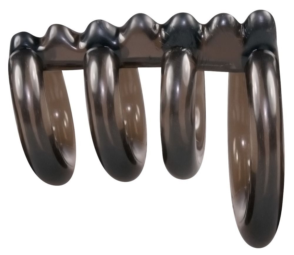 Cockring-set met ballenring. Donkere, transparante ringen. Meerdere ringen. Van rubber of siliconen. Golfvormige elementen.