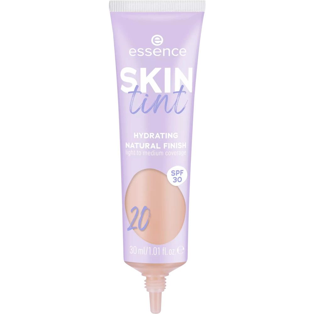 Fond de teint teinté dans un tube violet. Contient SPF 30. Inscription : SKIN tint, 20. 30 ml/1.01 fl. oz.