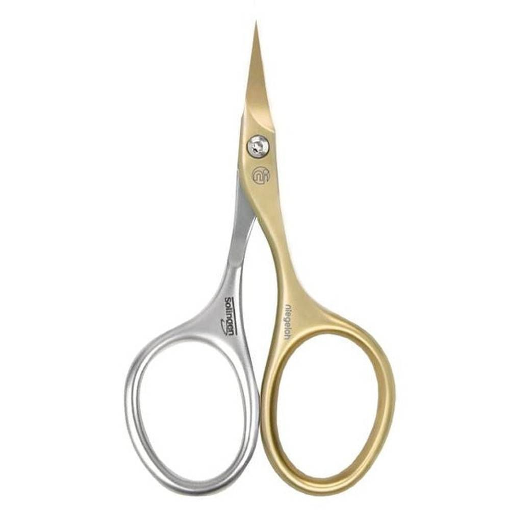 Niegeloh Solingen nagelriemschaar. Zilverkleurige handgrepen, goudkleurige bladen. Opschriften Solingen en Niegeloh.