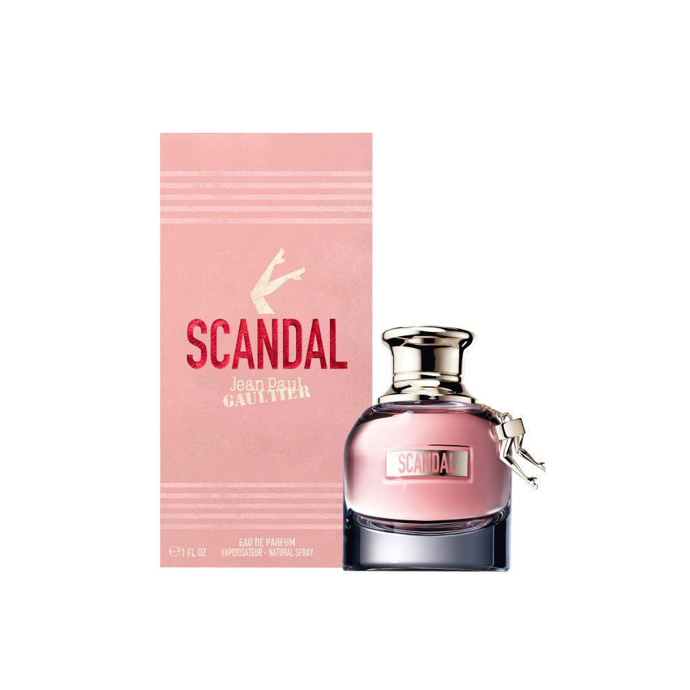 Boîte rose et flacon. Inscription "SCANDAL" et "Jean Paul Gaultier". Flacon avec jambes dorées.