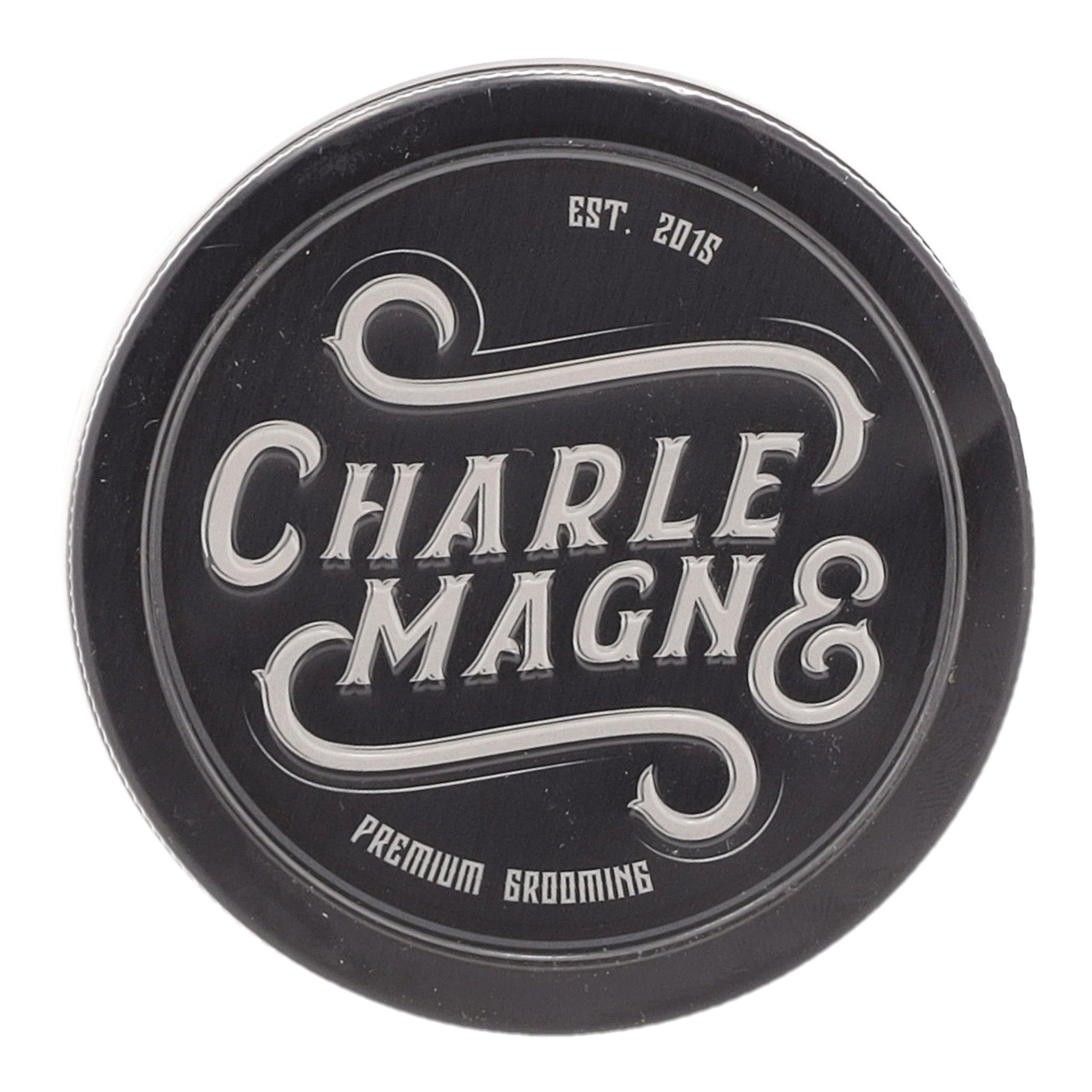 Couvercle noir avec inscription argentée "CHARLE MAGN & PREMIUM GROOMING".