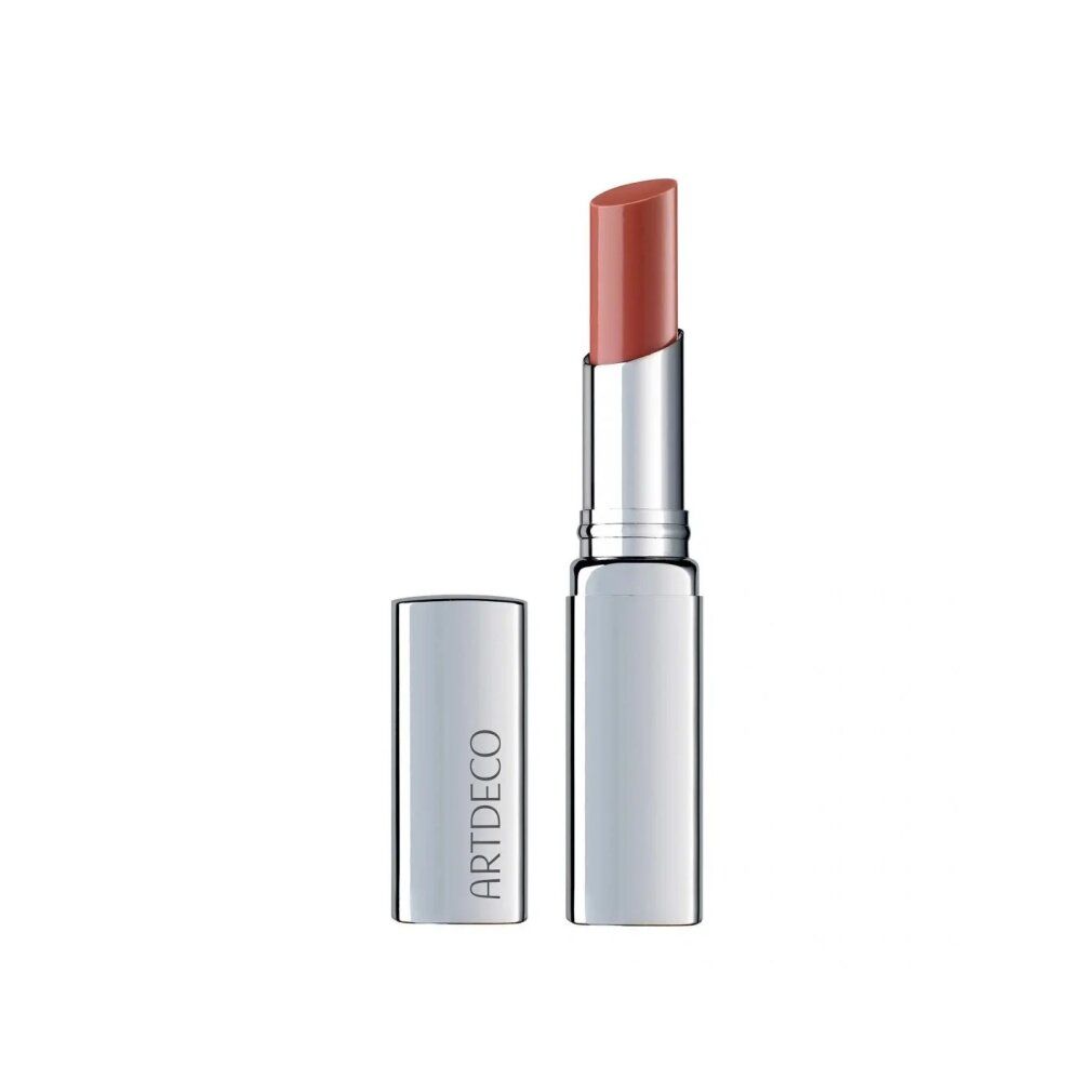 Lipbalsem met zilveren huls en open dop. De lipstick heeft een warme roze tint. "ARTDECO" staat op de huls.