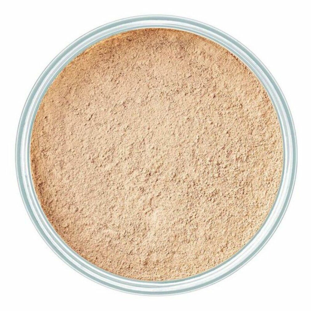 Vue de dessus d'un récipient de poudre libre. Couleur beige.