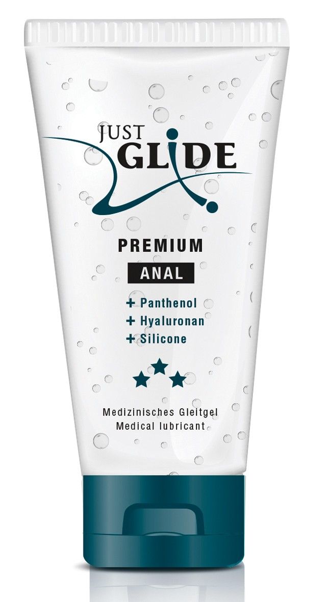 Transparante tube met blauwe dop. Opschrift: Just Glide Premium Anal. Bevat Panthenol, Hyaluronan, Silicone. Medische glijmiddel.