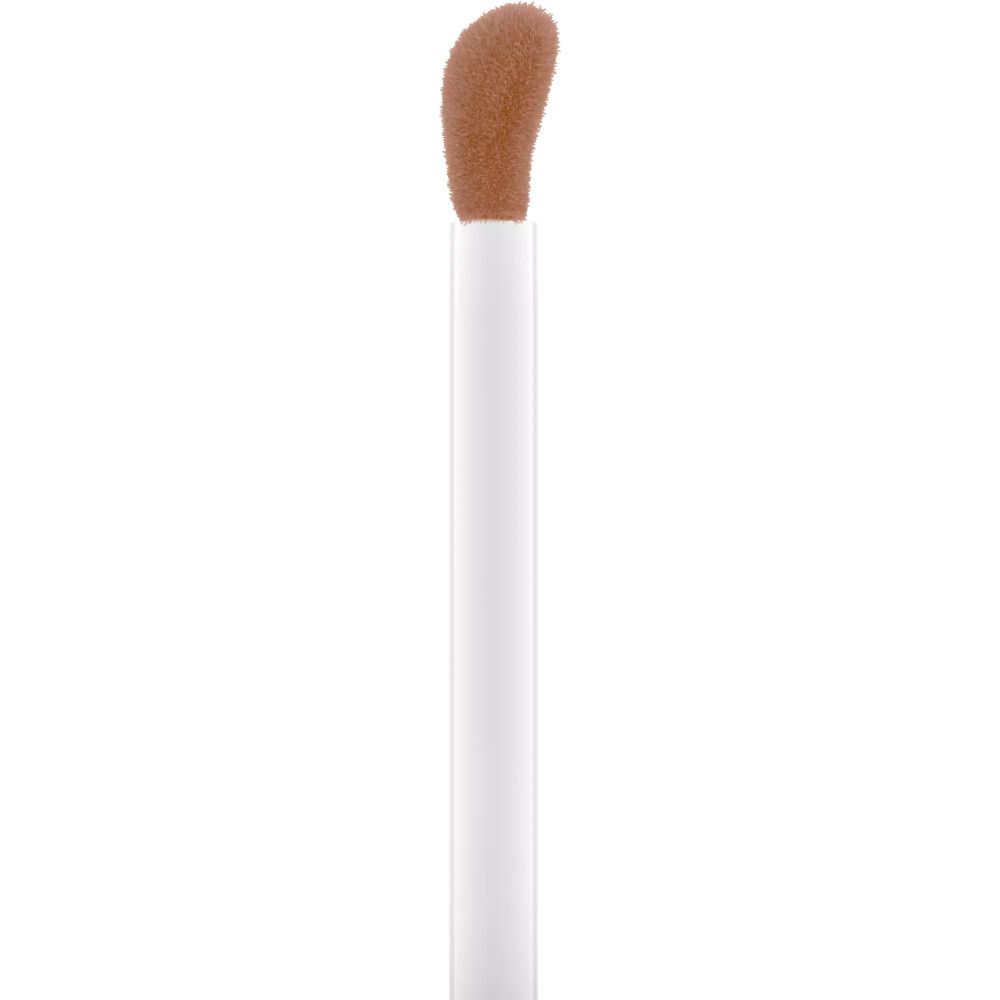 Applicateur de bronzer liquide. Manche blanc, embout marron.