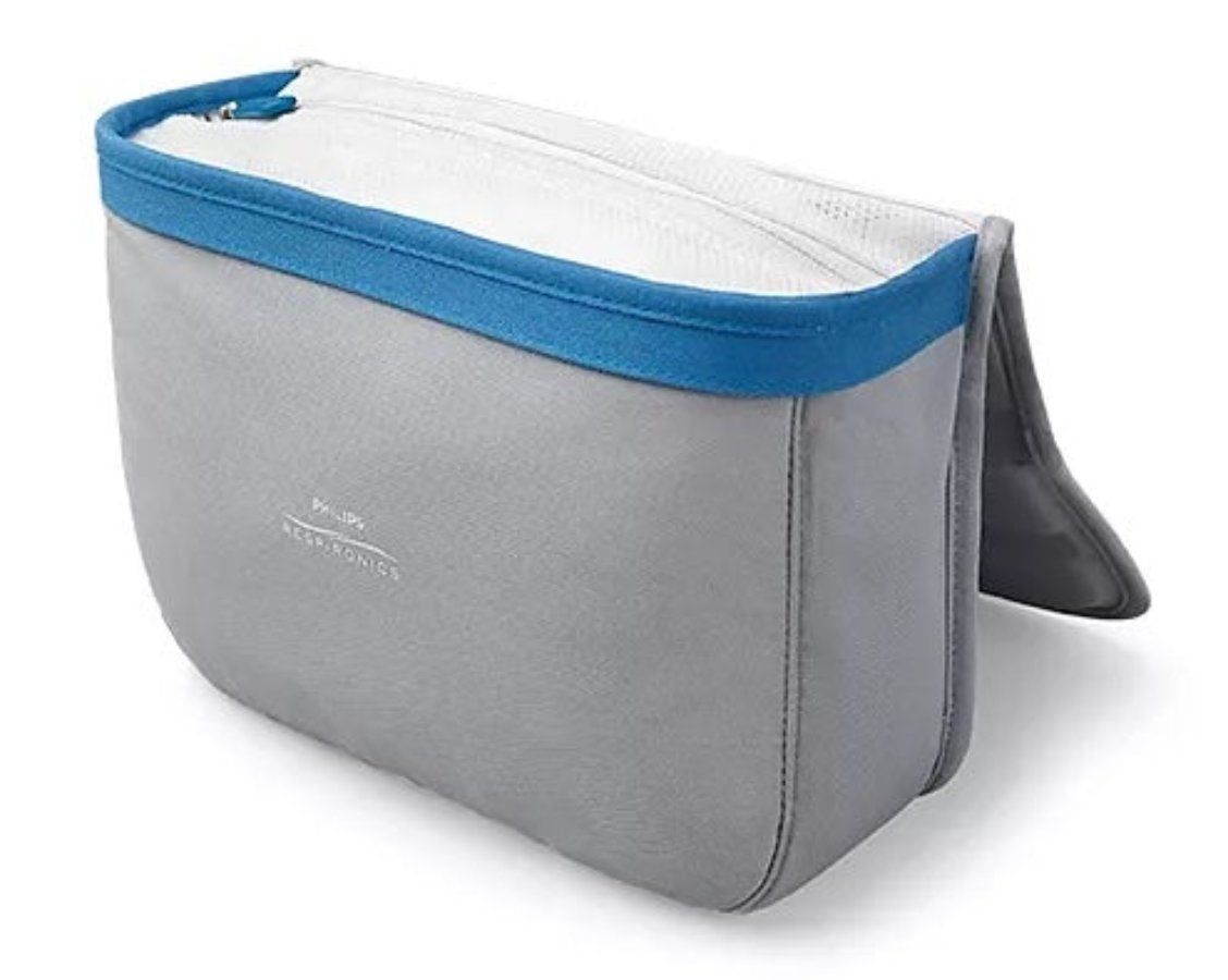 Organisateur en tissu gris avec bordure bleue et fermeture éclair. Logo Philips Respironics.