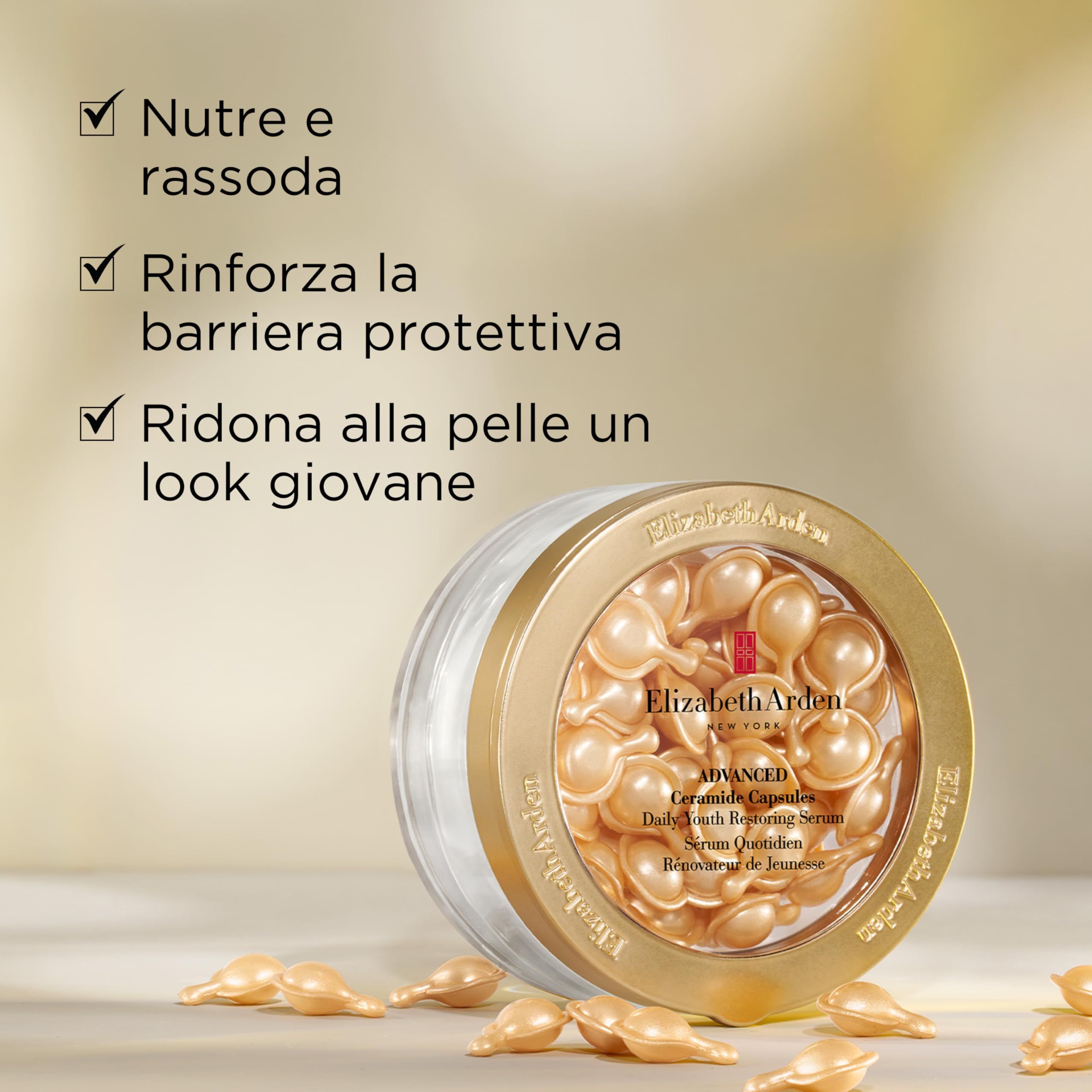 Boîte dorée avec capsules de sérum. Inscription : Elizabeth Arden, Advanced Ceramide Capsules, Daily Youth Restoring Serum. Texte en italien.