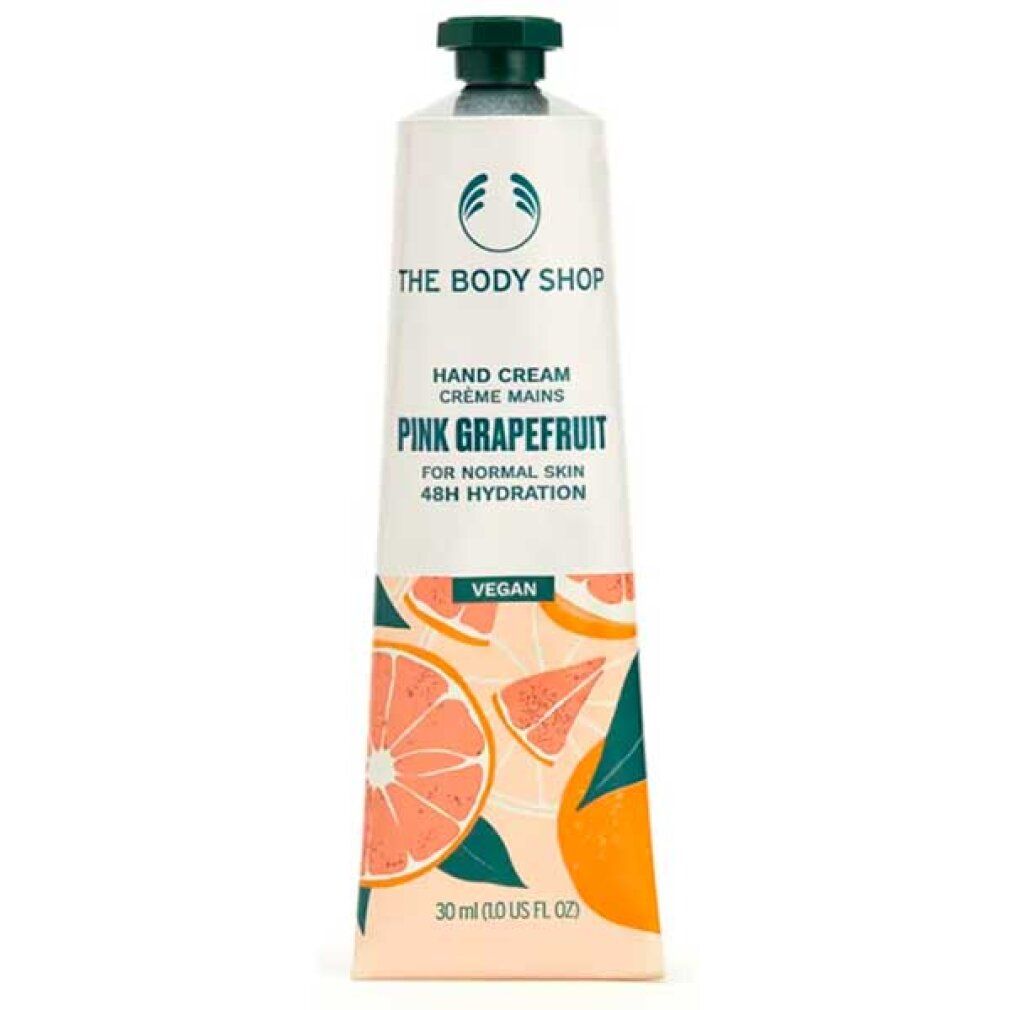 Handcrèmetube. Wit, met groene dop. Opschrift: Pink Grapefruit, Vegan. Illustraties van grapefruit. Merk: The Body Shop.