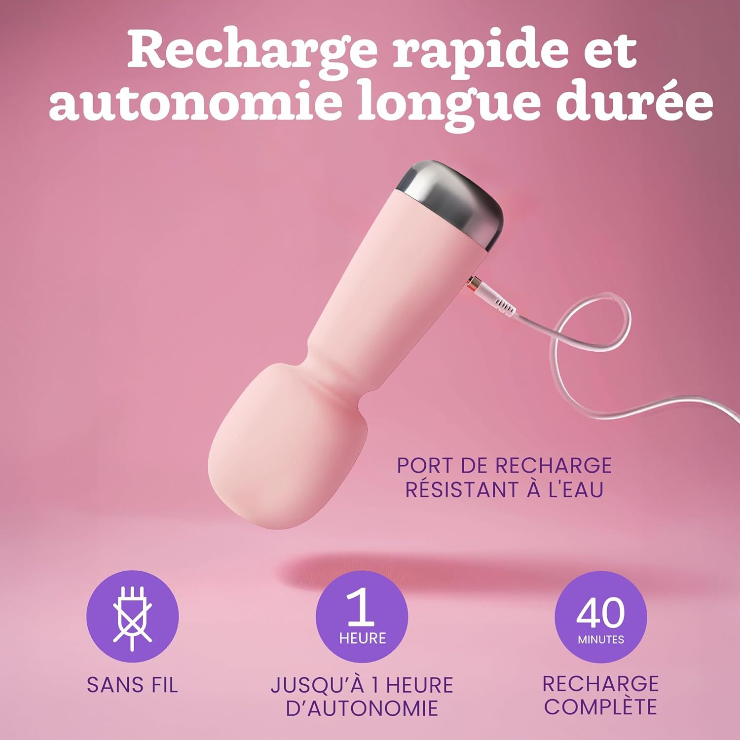 Vibrateur rose avec capuchon argenté et câble de chargement. Port de charge étanche.