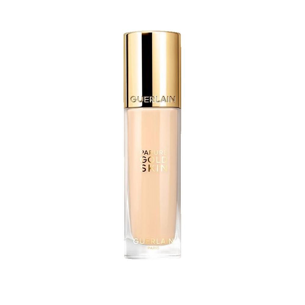 Guerlain Parure Gold vloeibare foundation in glazen fles met gouden dop. Opschrift: Natural Skin. Lichtbeige vloeistof.