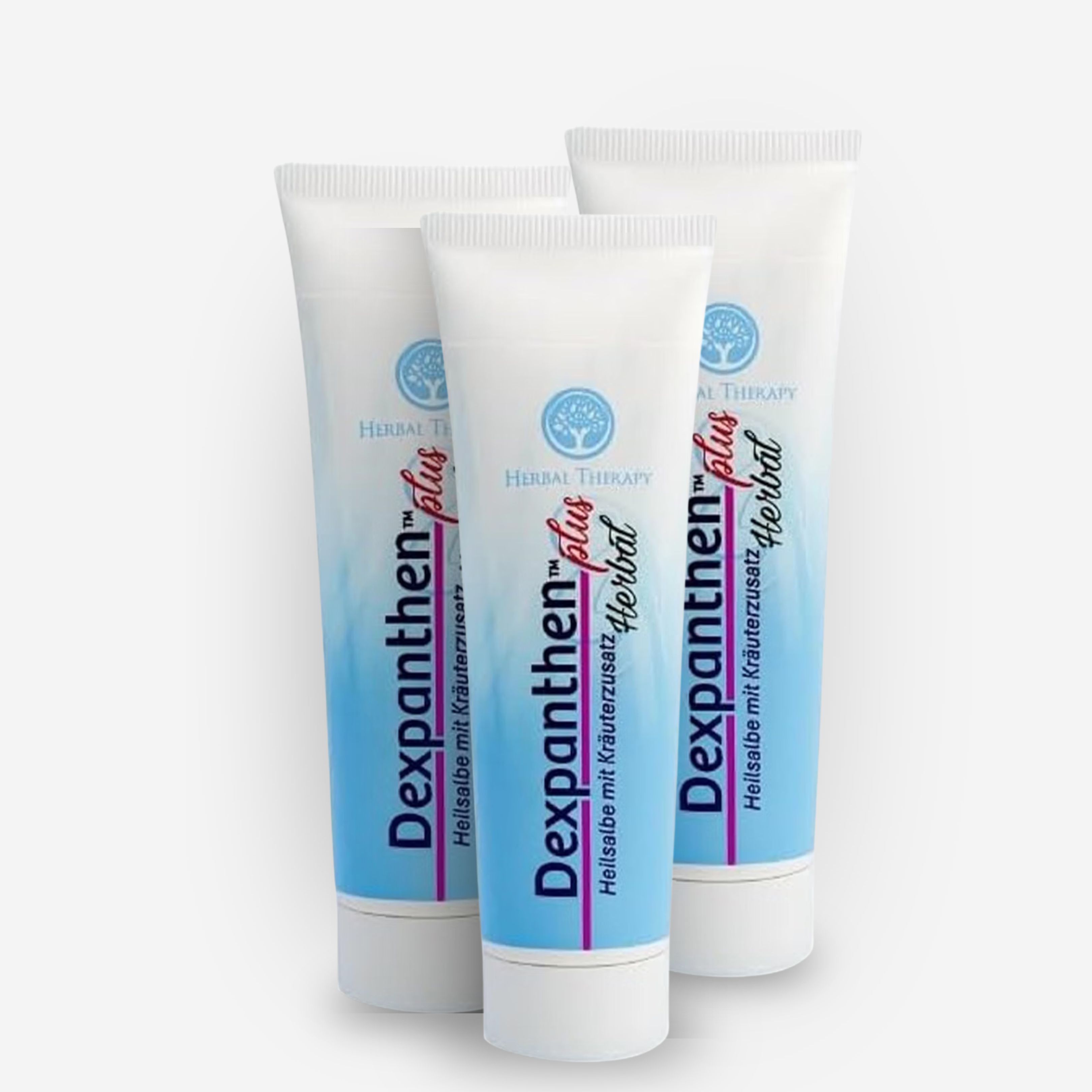 Trois tubes blancs de crème Dexpanthenol Plus Herbal avec extrait de plantes.