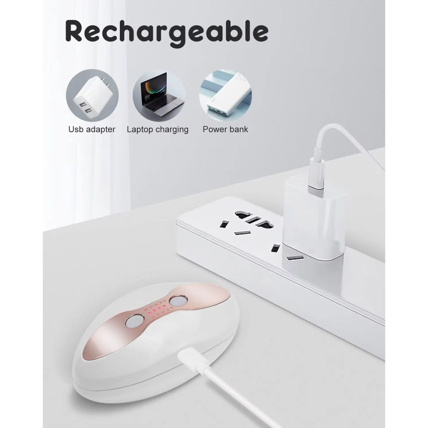 Appareil blanc et or rose, rechargeable par USB. Montré avec adaptateur, ordinateur portable et batterie externe.