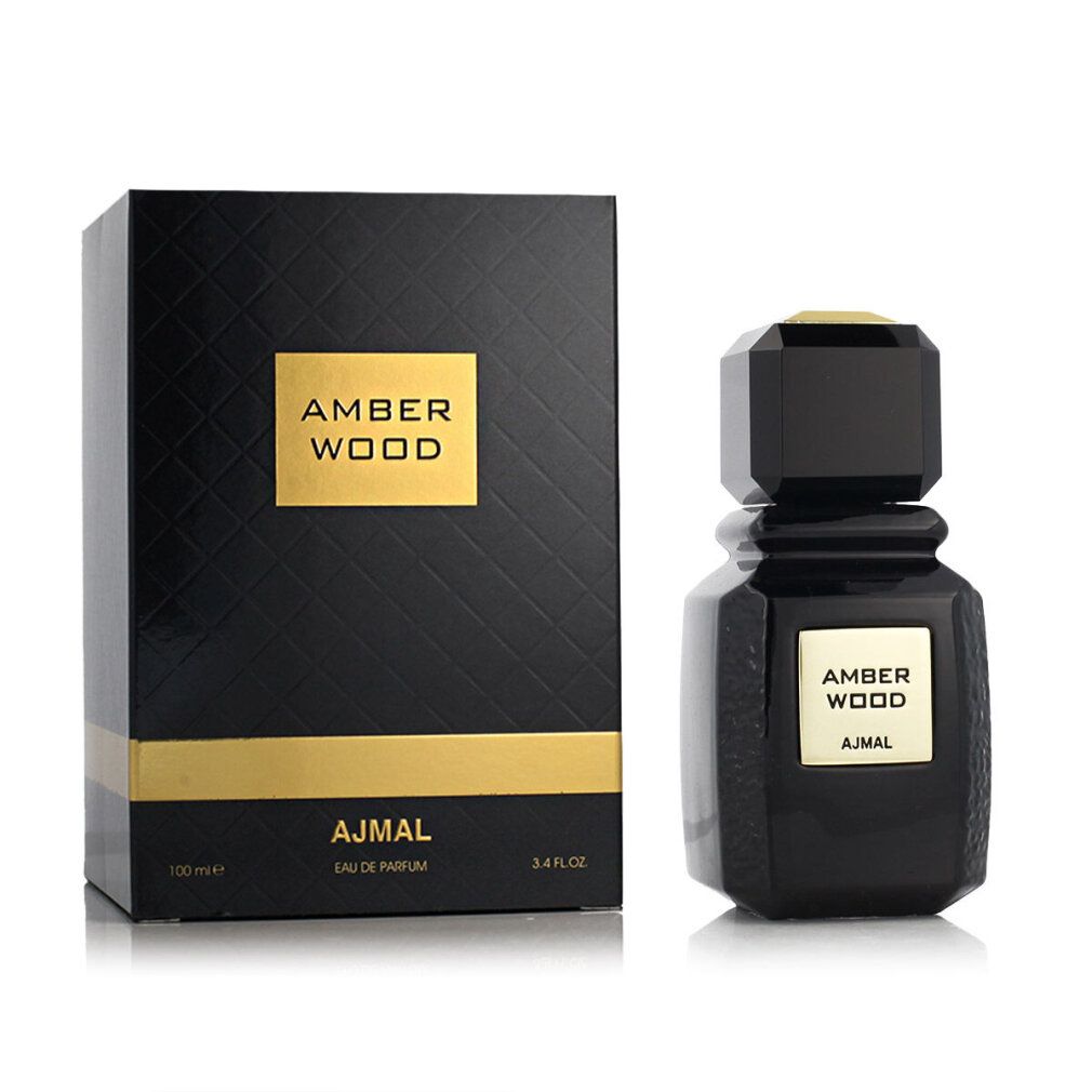 Flacon et boîte noirs. Flacon avec étiquette dorée AMBER WOOD et AJMAL. Boîte avec gaufrage.