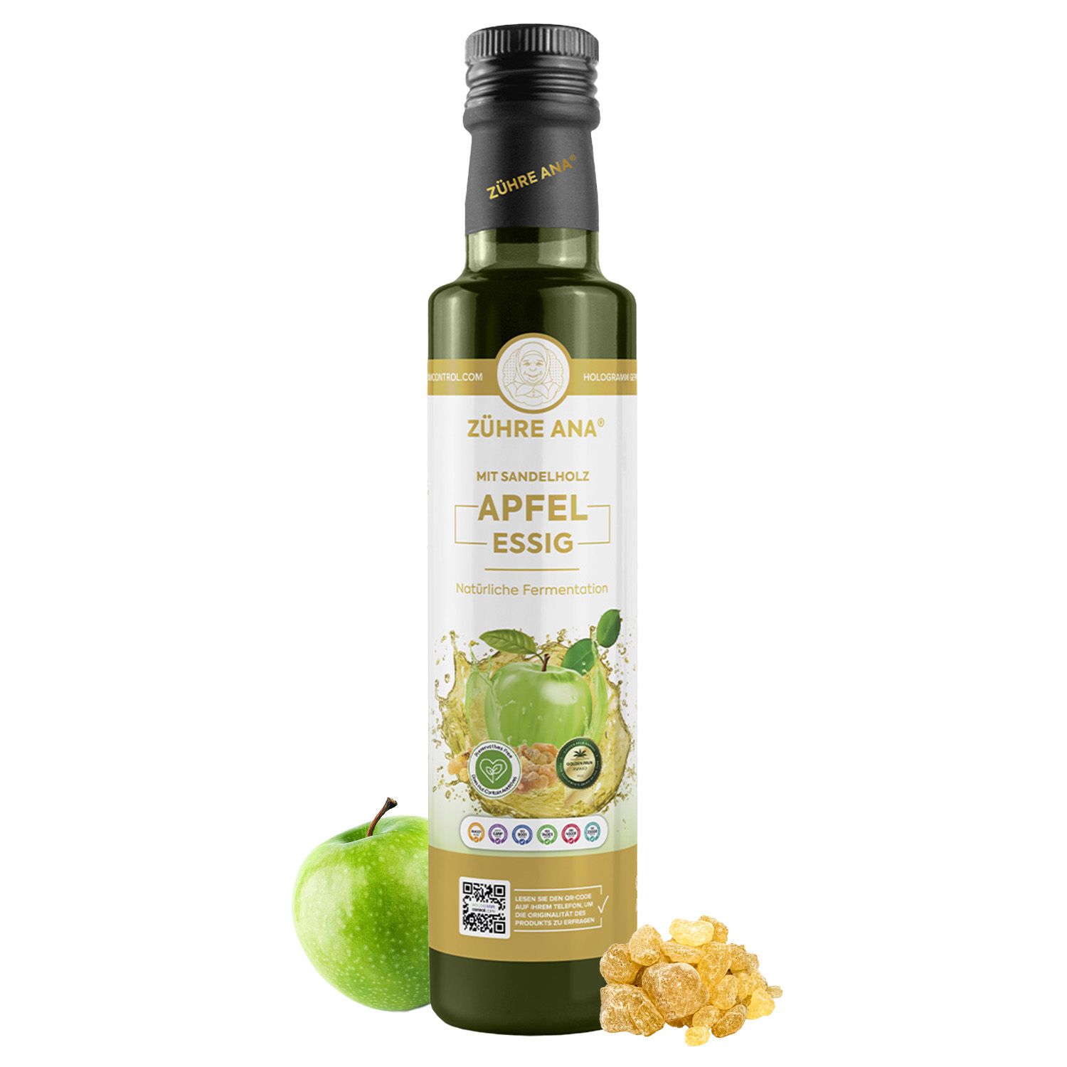 Fles appelazijn met sandelhout, naast een groene appel en barnsteenachtige stukjes.