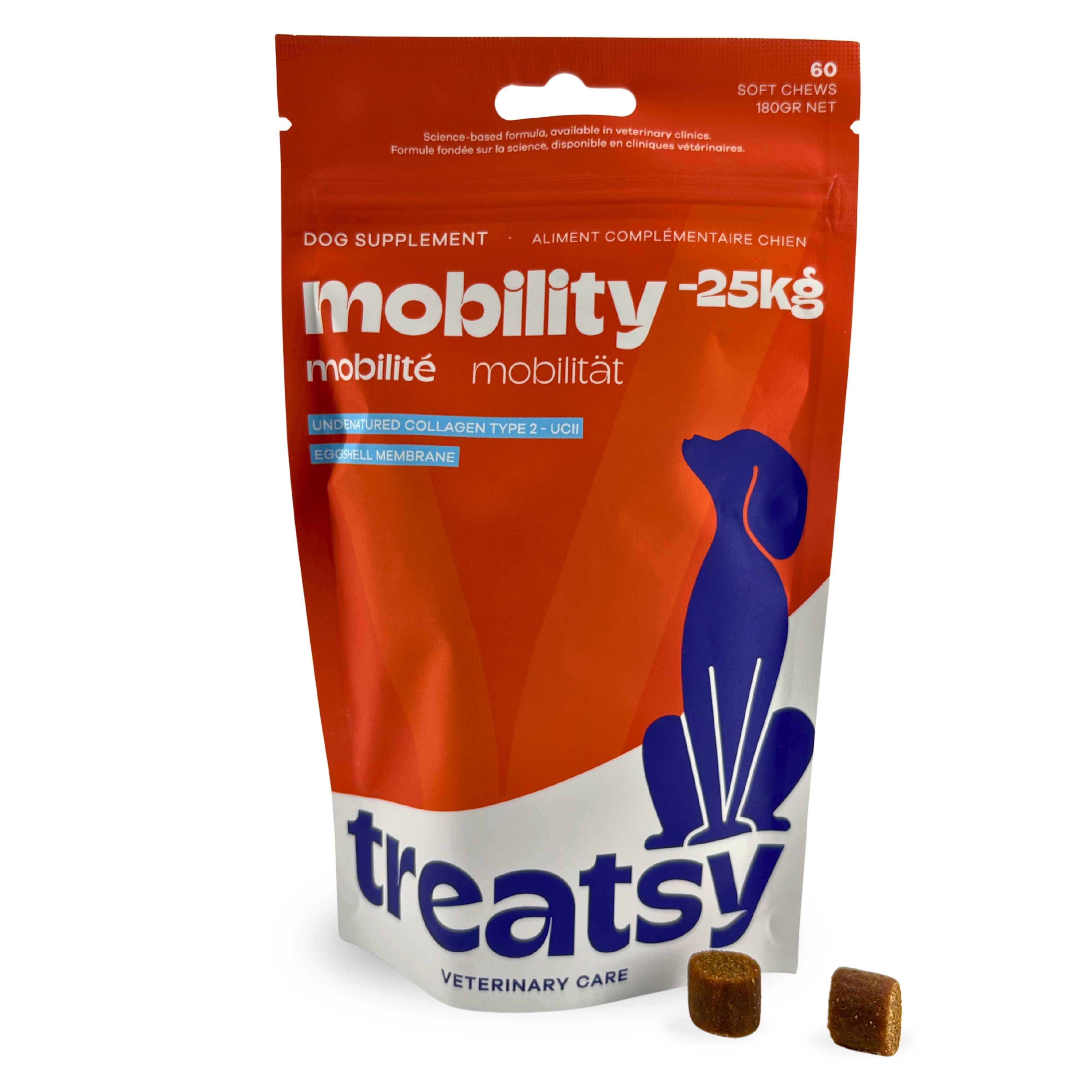 Rode zak met "mobility" en "Treatsy". Twee bruine tabletten ernaast.
