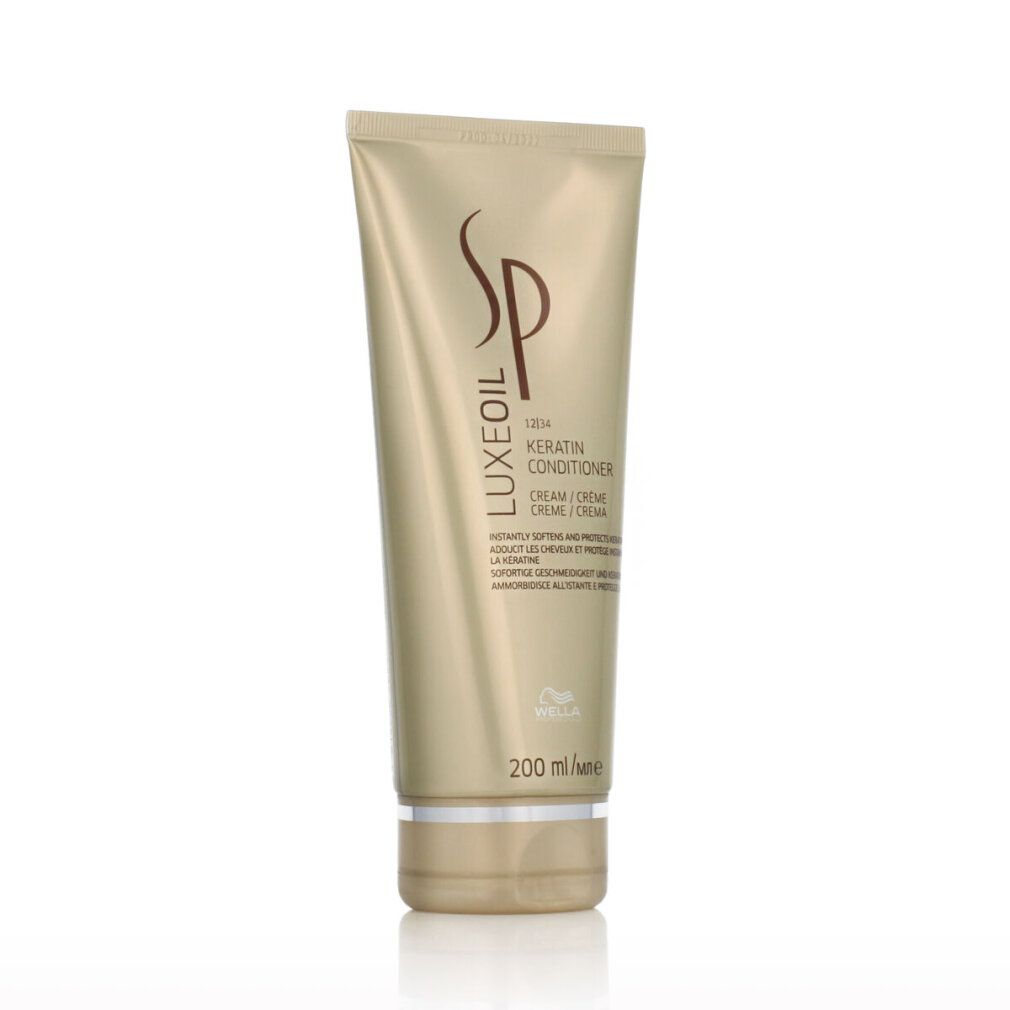 Gouden tube met SP Luxe Oil Keratin Conditioner. Logo en opschrift. 200 ml. Zilverkleurige onderkant.