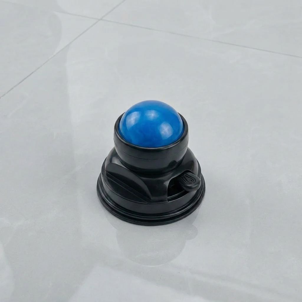 Support de massage noir avec une boule bleue.