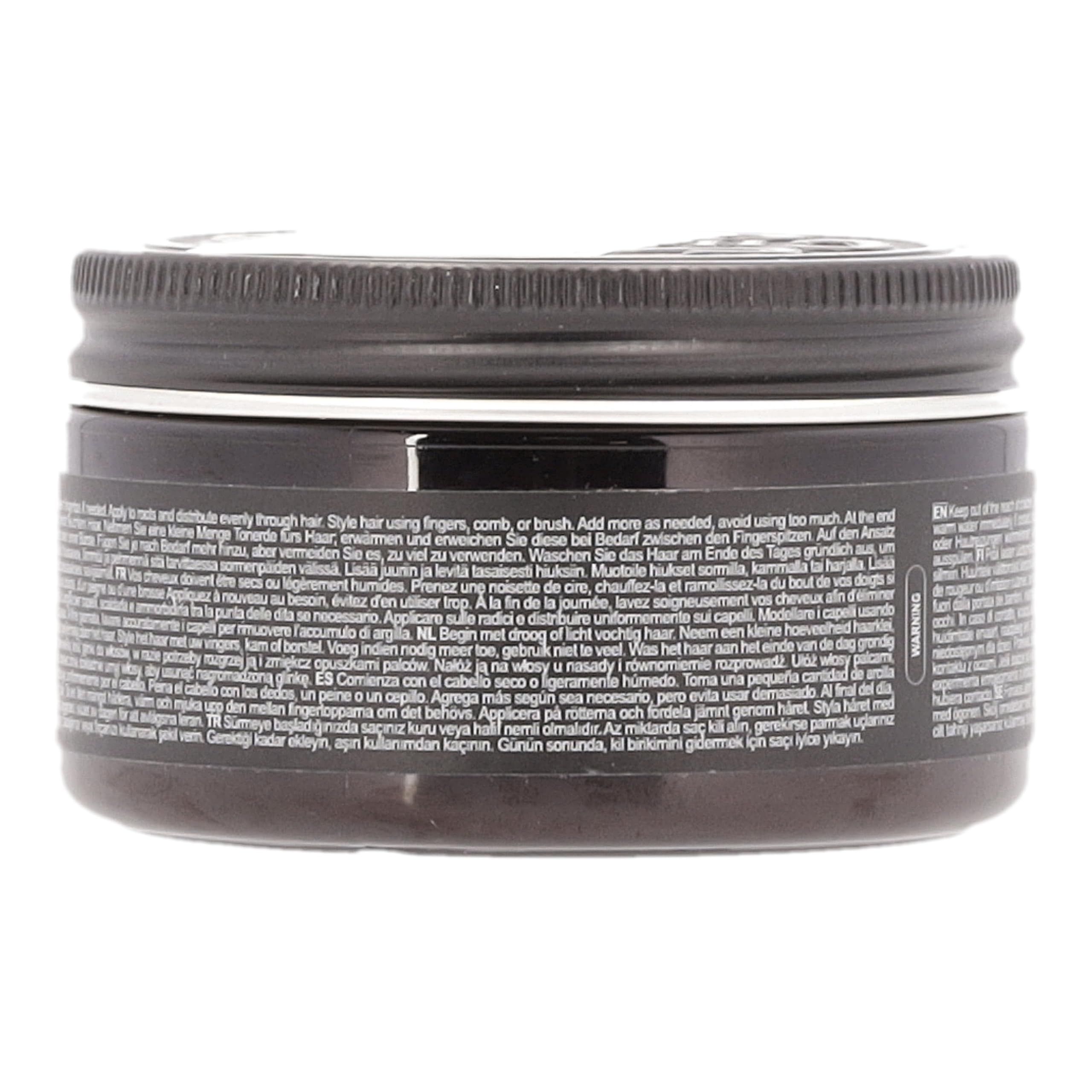 Couvercle noir avec inscription argentée "CHARLE MAGN & PREMIUM GROOMING".