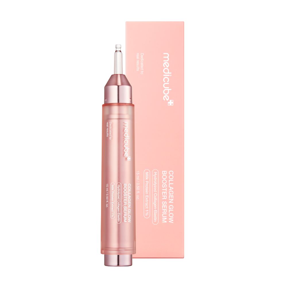 Applicateur de sérum rose avec embout argenté et transparent. Boîte rose à côté.