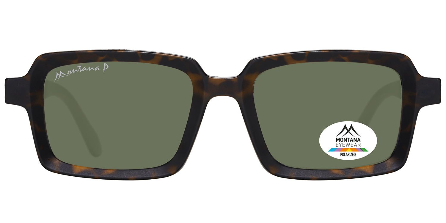 Lunettes de soleil à monture marron et verres verts. Un autocollant avec le logo Montana Eyewear est apposé sur un verre.