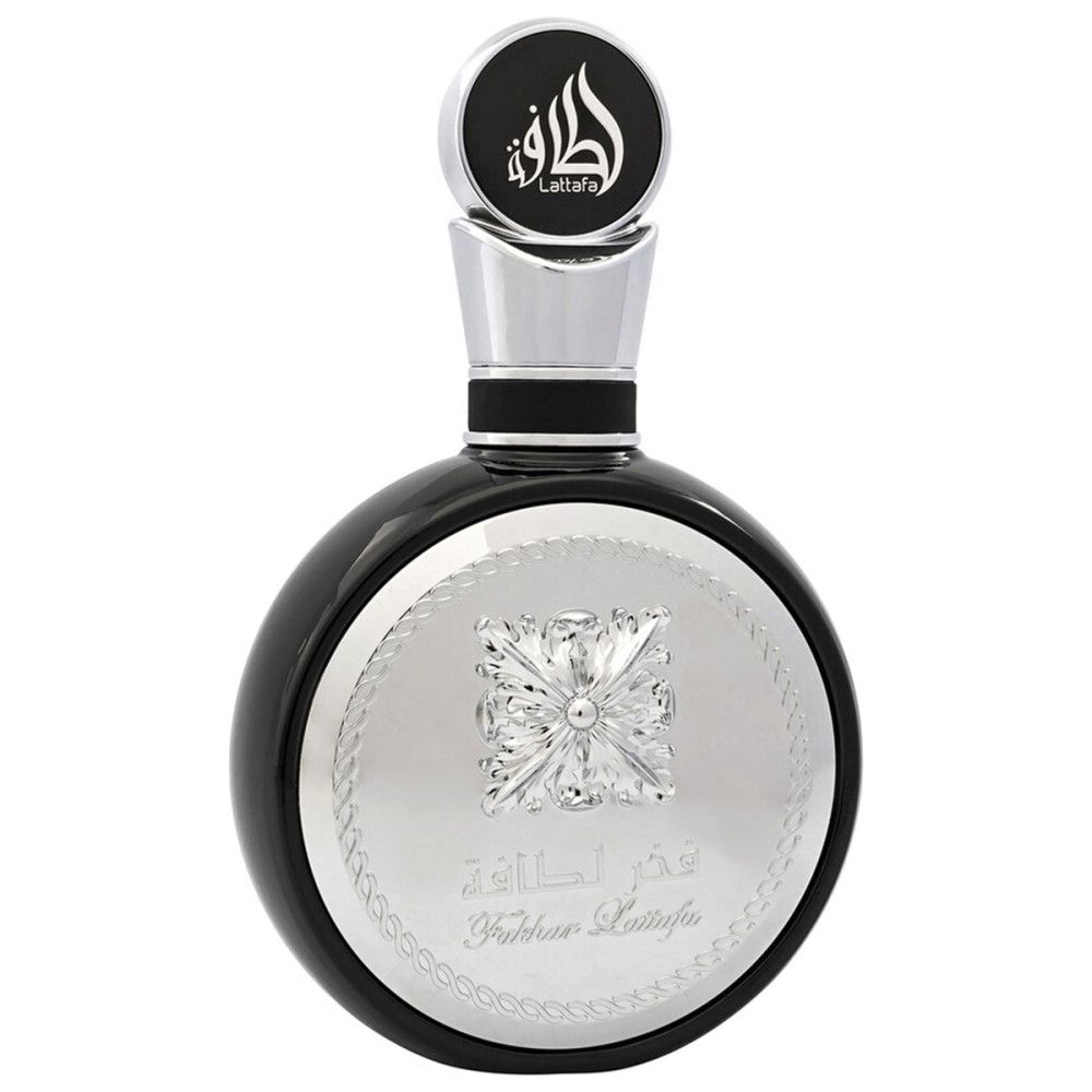 Flacon de parfum rond noir avec garniture argentée. Inscription en caractères arabes.