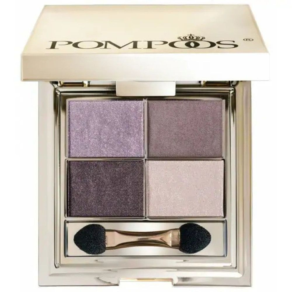 Palette de fards à paupières carrée, quatre couleurs. Boîtier doré avec logo de la marque. Contient un applicateur.