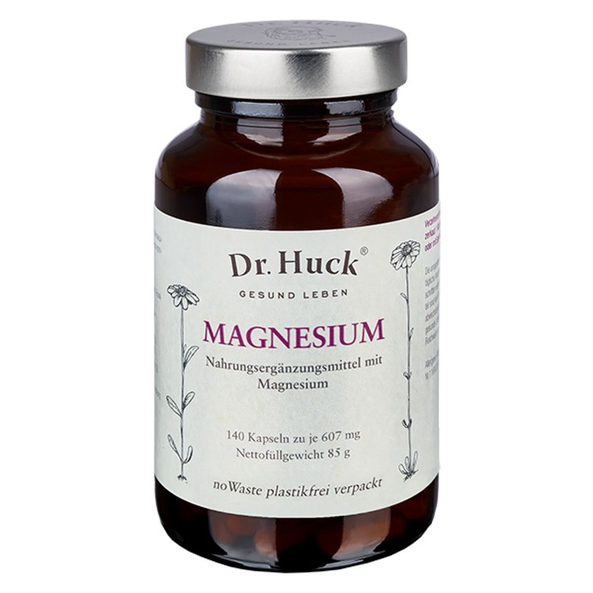Bruine glazen fles met "Dr. Huck Magnesium". Opschrift: "140 capsules". Voedingssupplement met magnesium.
