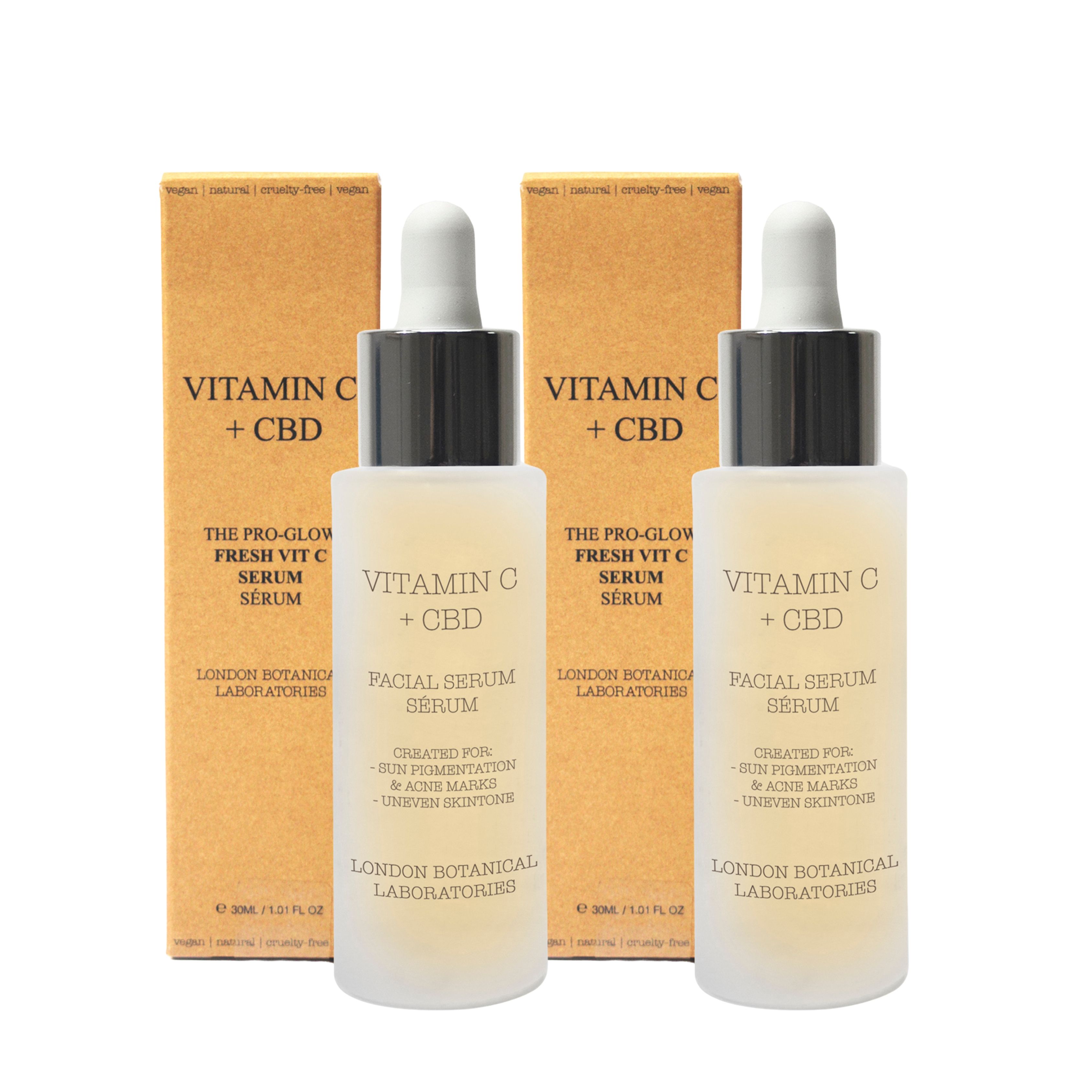 Deux flacons de sérum avec pipettes et deux boîtes. Inscription: Vitamin C + CBD. Texte: Facial Serum, London Botanical Laboratories.