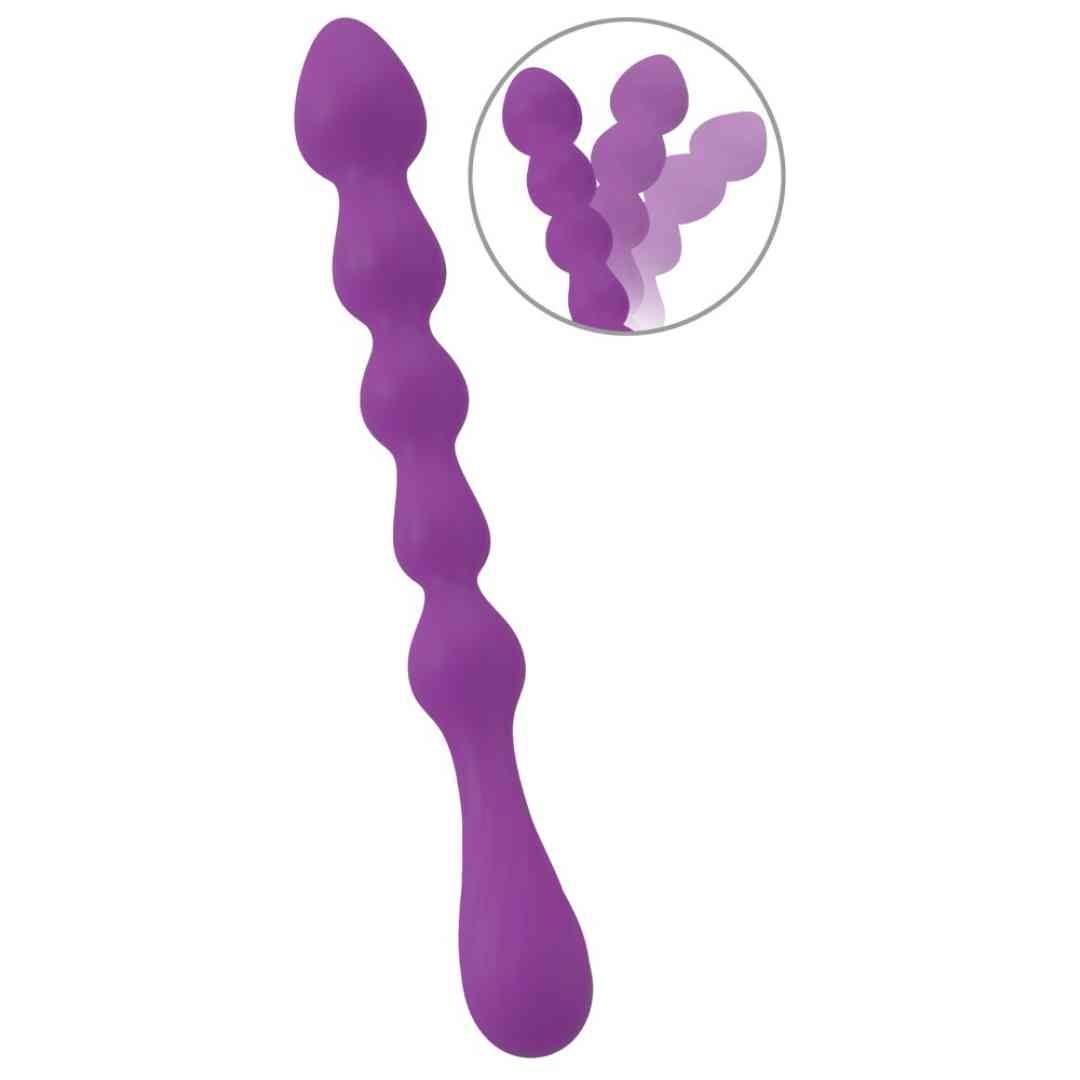Plug anal violet, ondulé, avec manche côtelé et extrémité arrondie. Vue détaillée dans un cercle.