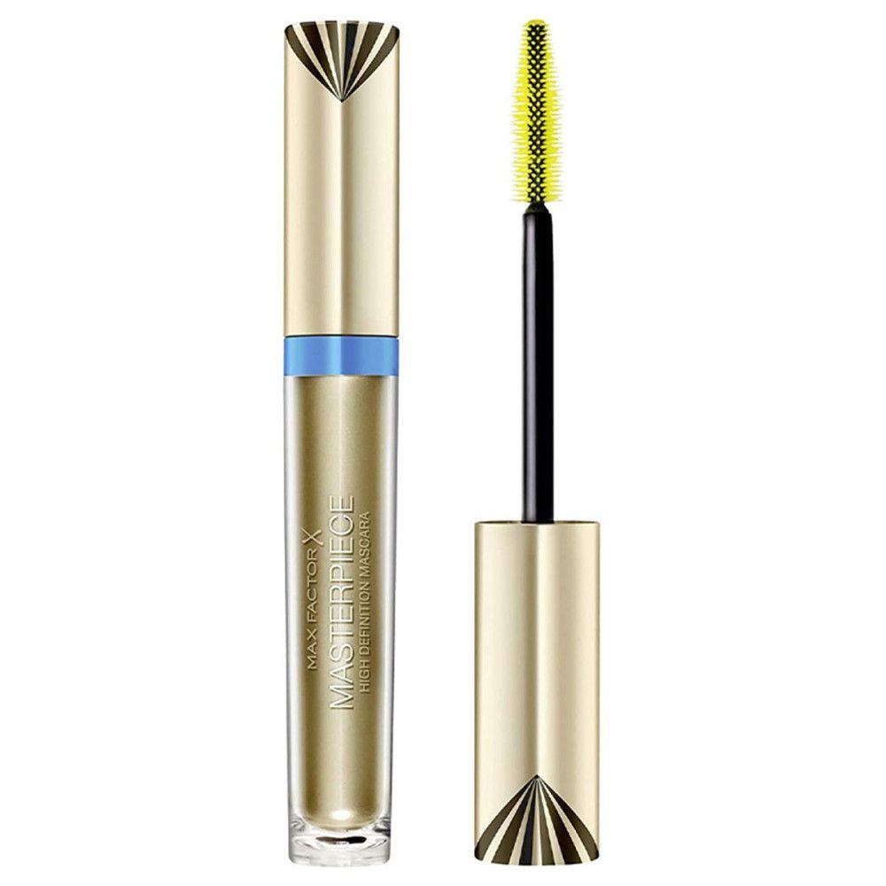 Tube de mascara doré avec bande bleue. Brosse à cils avec poils jaunes. Tige noire. Nom du produit et marque visibles.