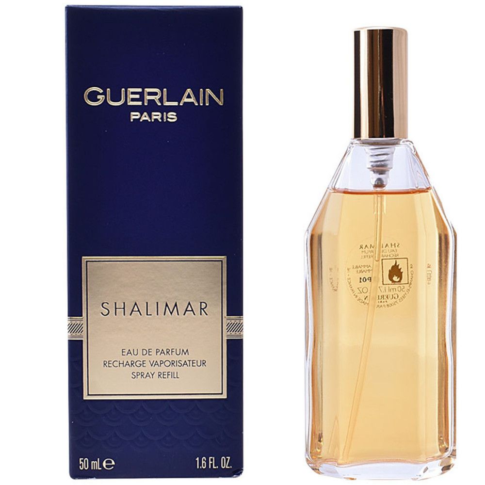 Boîte bleue foncée et flacon. GUERLAIN PARIS et SHALIMAR sur la boîte. Flacon transparent avec bouchon doré.