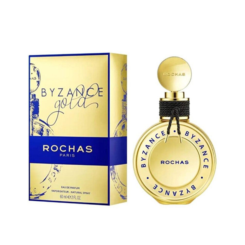 Gouden doos en fles. Opschrift: BYZANCE Gold, ROCHAS PARIS. Fles met zwart koord.