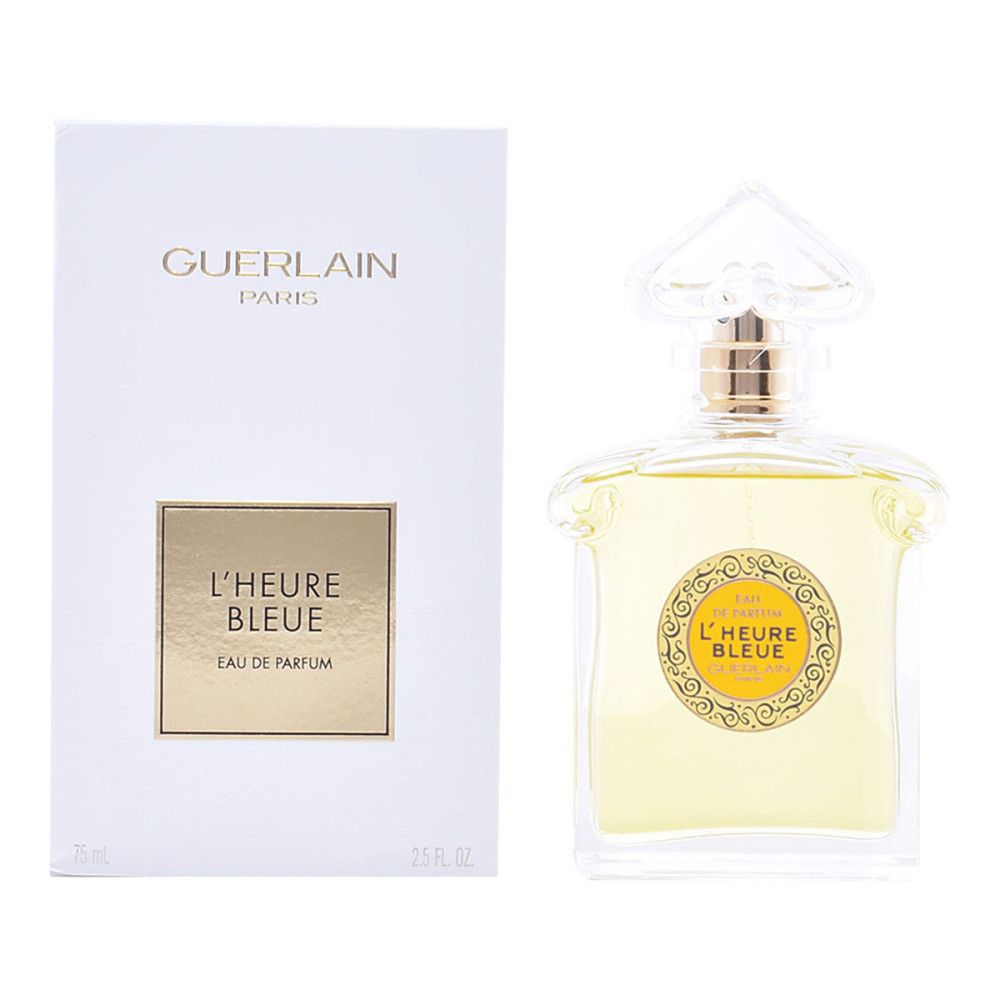 Parfumfles naast witte doos. Op de doos: GUERLAIN PARIS, L'HEURE BLEUE, Eau de Parfum. Fles met gele vloeistof.